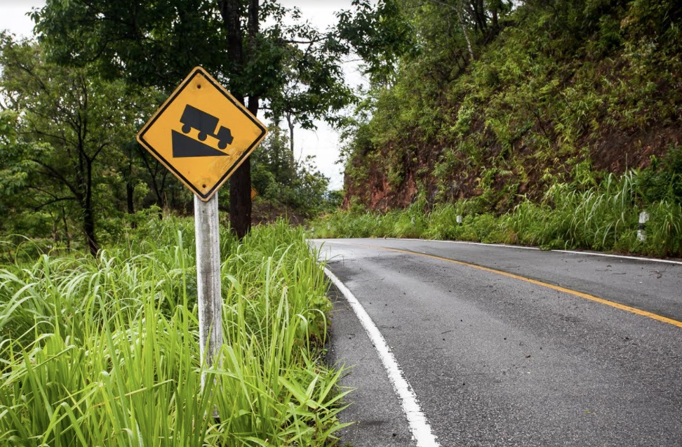cruise control speeds up downhill